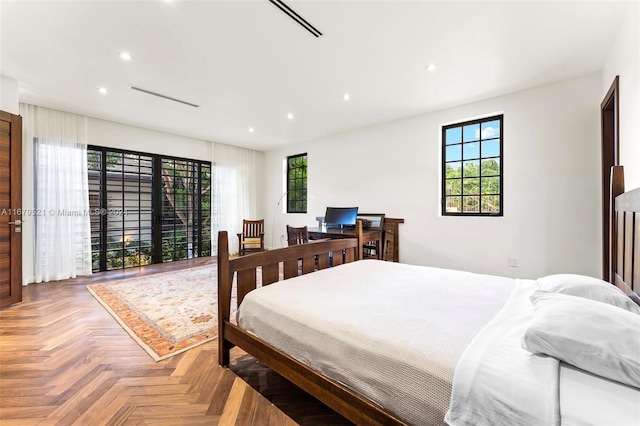 bedroom featuring parquet flooring