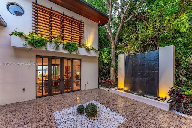 exterior space with french doors and a patio area