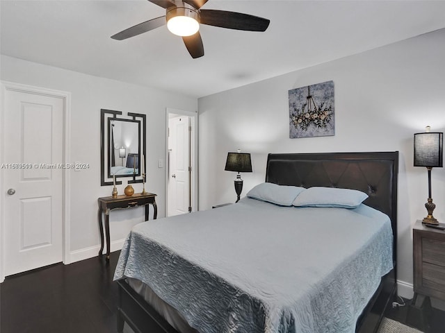 bedroom featuring dark hardwood / wood-style floors and ceiling fan