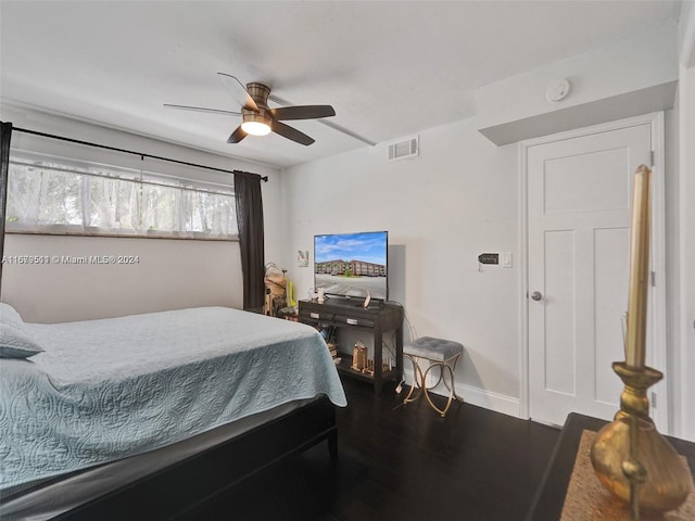 bedroom featuring dark hardwood / wood-style floors and ceiling fan