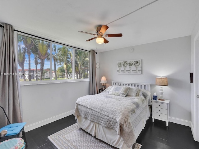 bedroom featuring dark wood-type flooring and ceiling fan