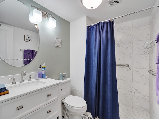 bathroom featuring vanity, toilet, and a shower with shower curtain