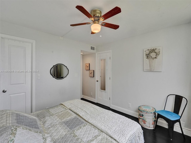 bedroom with wood-type flooring and ceiling fan