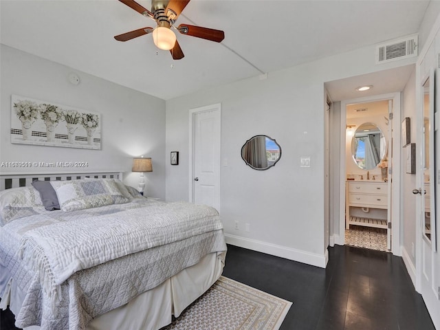 bedroom featuring sink, dark hardwood / wood-style floors, and ceiling fan