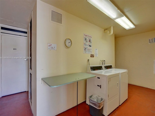 clothes washing area with independent washer and dryer