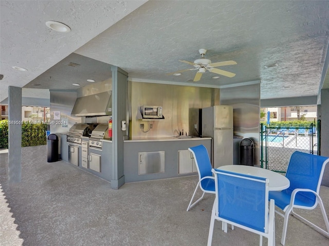 view of patio / terrace featuring sink, exterior kitchen, grilling area, and ceiling fan