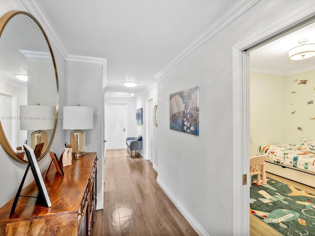 hall featuring ornamental molding and dark hardwood / wood-style floors