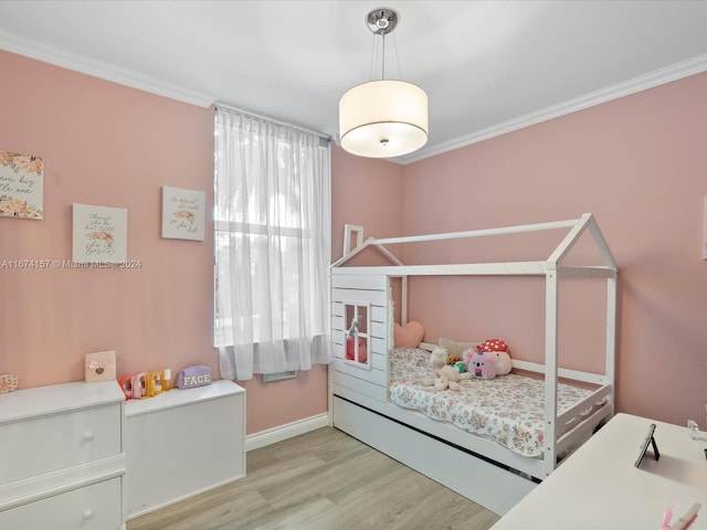 bedroom featuring light hardwood / wood-style floors and ornamental molding