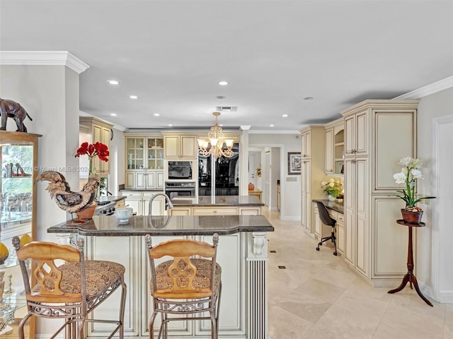 449 Isle Of Palms Dr, Fort Lauderdale, FL 33301 - kitchen with cream cabinets, a chandelier, stainless steel oven, and recessed lighting