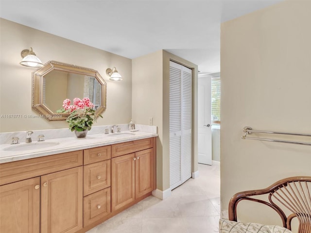 449 Isle Of Palms Dr, Fort Lauderdale, FL 33301 - bathroom featuring a sink, baseboards, tile patterned flooring, and double vanity