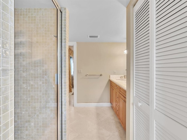 449 Isle Of Palms Dr, Fort Lauderdale, FL 33301 - bathroom with a closet, vanity, tile patterned flooring, baseboards, and a shower stall