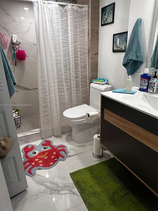 bathroom featuring vanity, toilet, and a shower with shower curtain