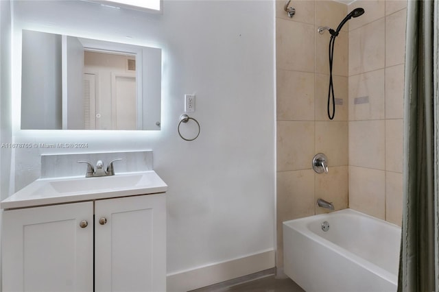 bathroom featuring vanity and tiled shower / bath combo