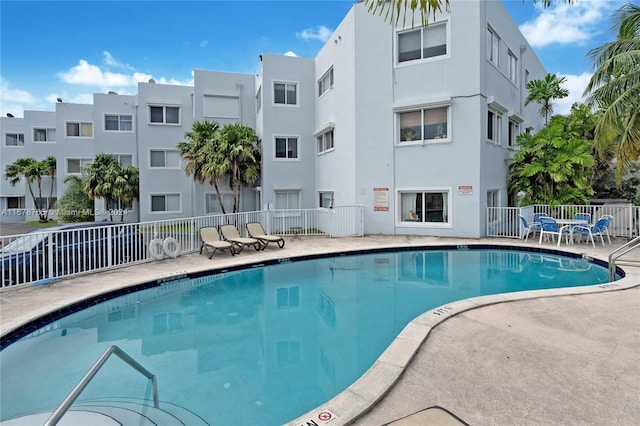 view of swimming pool featuring a patio area