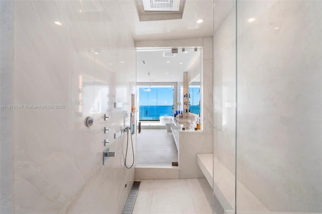 bathroom featuring a walk in shower, visible vents, and tile patterned floors