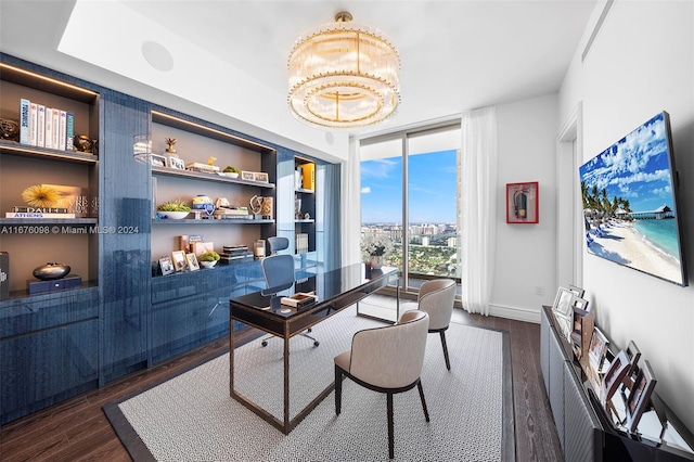 office space featuring dark hardwood / wood-style flooring, expansive windows, and an inviting chandelier