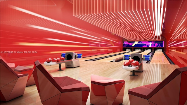 game room with hardwood / wood-style flooring and a bowling alley