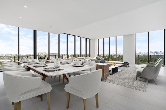 dining room featuring light tile patterned floors and expansive windows