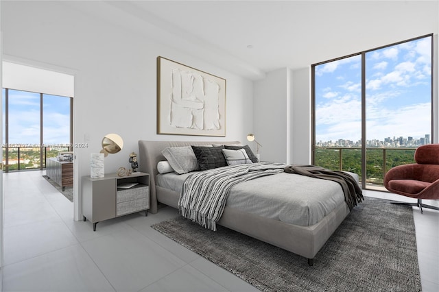 bedroom with light tile patterned floors, access to outside, and multiple windows