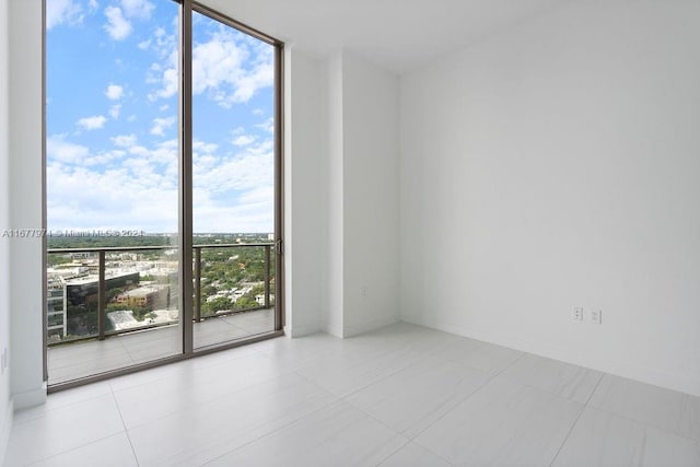 unfurnished room featuring light tile patterned floors