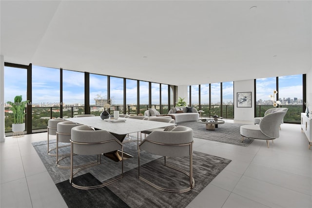 dining room featuring expansive windows and light tile patterned floors