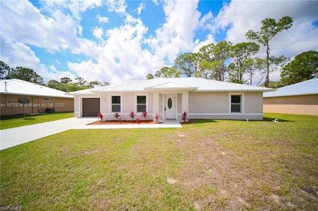 view of front of home featuring a front lawn and a garage