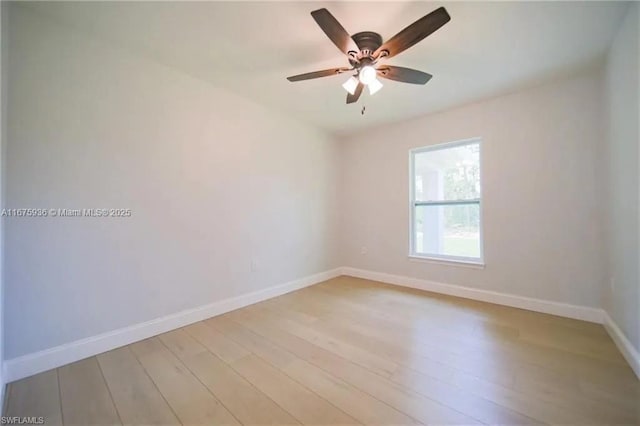 spare room featuring light wood-type flooring and ceiling fan