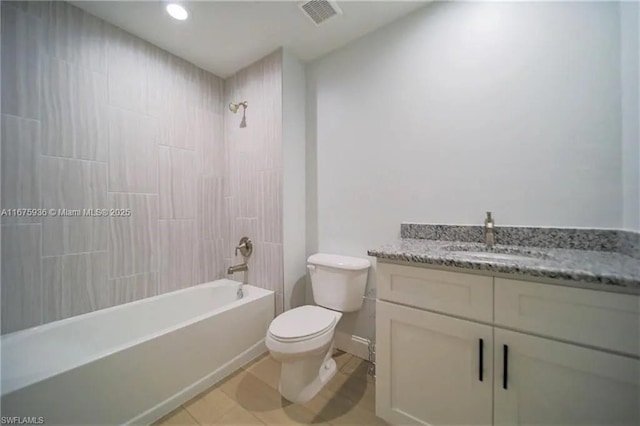 full bathroom featuring tile patterned floors, vanity, bathtub / shower combination, and toilet