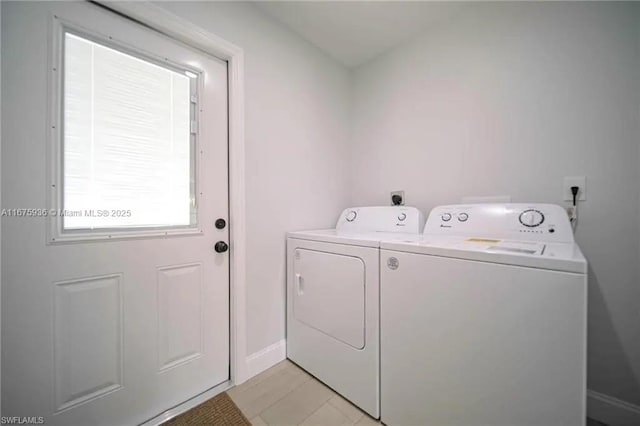 washroom with washing machine and clothes dryer