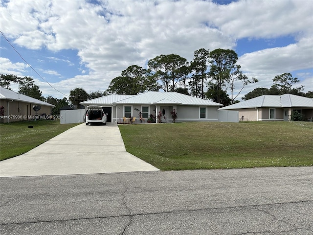 view of front of house featuring a garage and a front yard