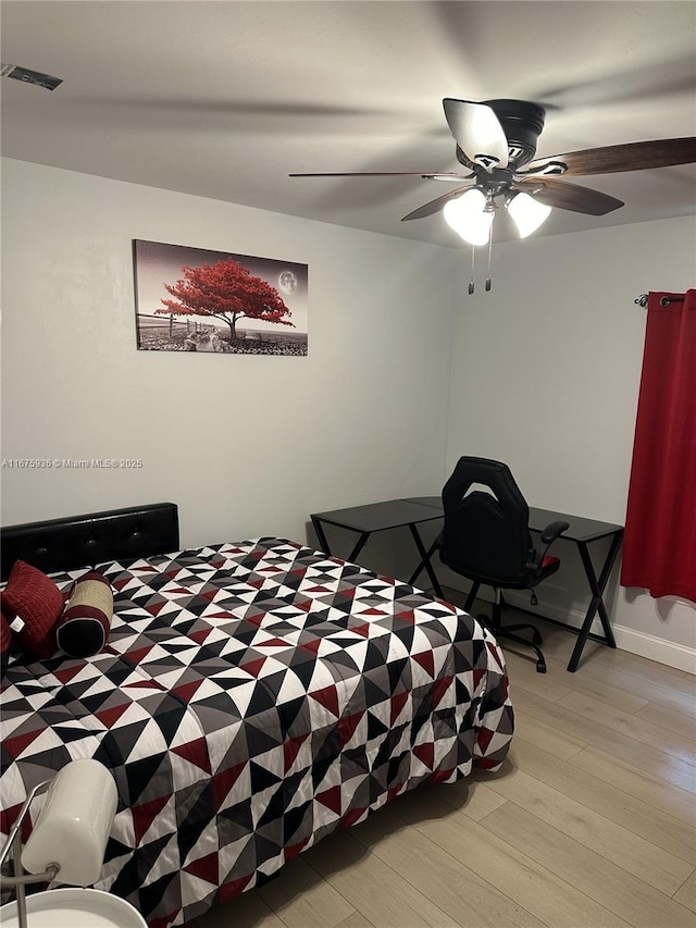 bedroom featuring light hardwood / wood-style floors and ceiling fan