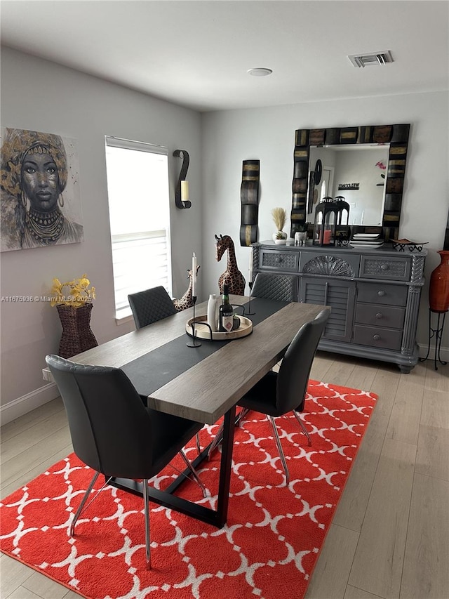 dining area with light hardwood / wood-style flooring