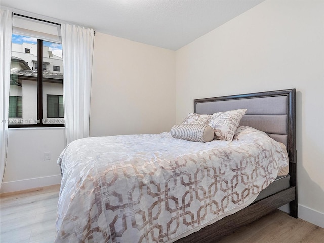 bedroom with light wood-type flooring