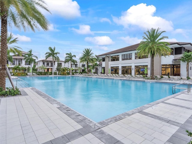 view of swimming pool featuring a patio area