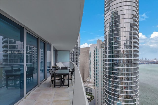 balcony featuring a water view