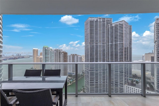 balcony featuring a water view