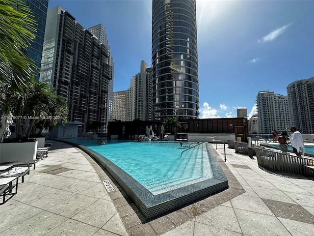 view of pool featuring a patio