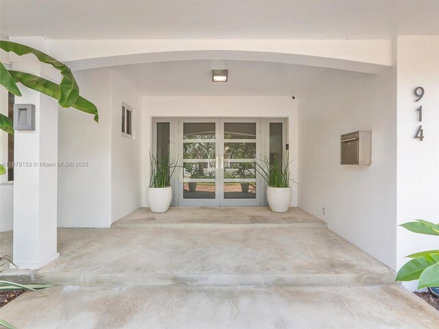 doorway to property featuring french doors