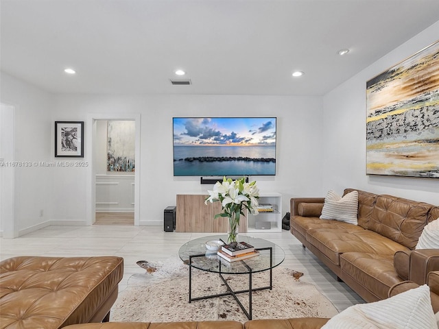 living room with visible vents, recessed lighting, and baseboards