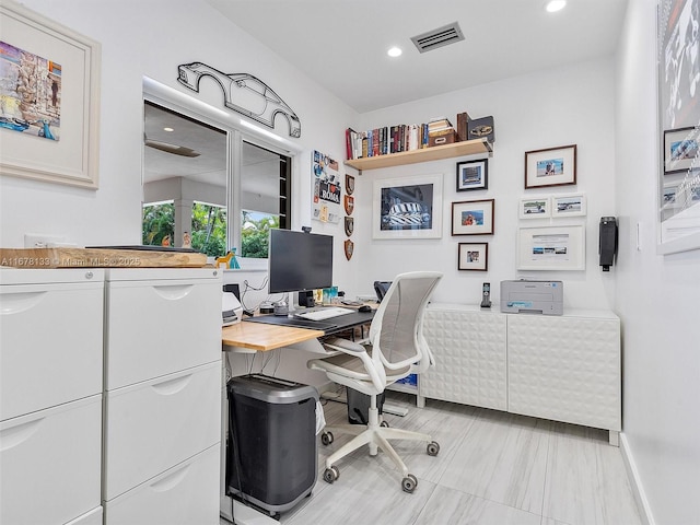 office space featuring recessed lighting, visible vents, and baseboards