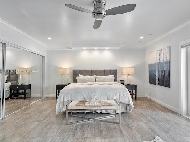 bedroom featuring wood finished floors, baseboards, and ornamental molding