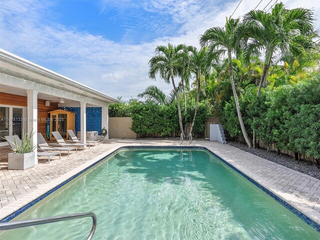 view of swimming pool with a patio area