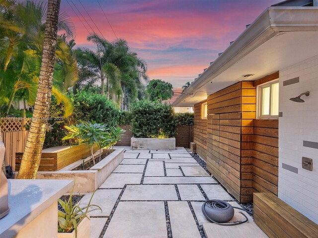 view of patio terrace at dusk