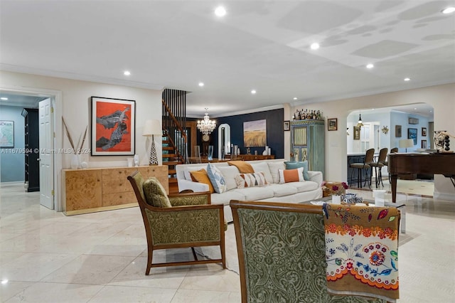 living room featuring ornamental molding and an inviting chandelier