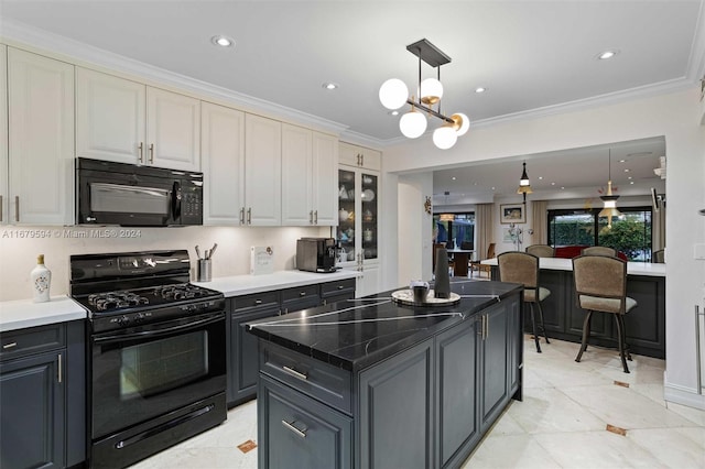 kitchen featuring black appliances, a kitchen island, pendant lighting, gray cabinets, and crown molding