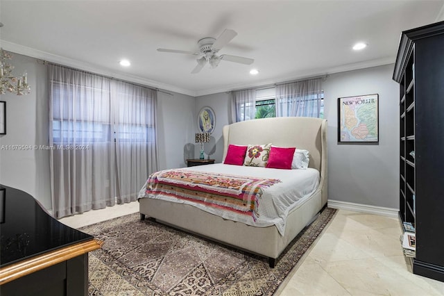 bedroom with ceiling fan and crown molding