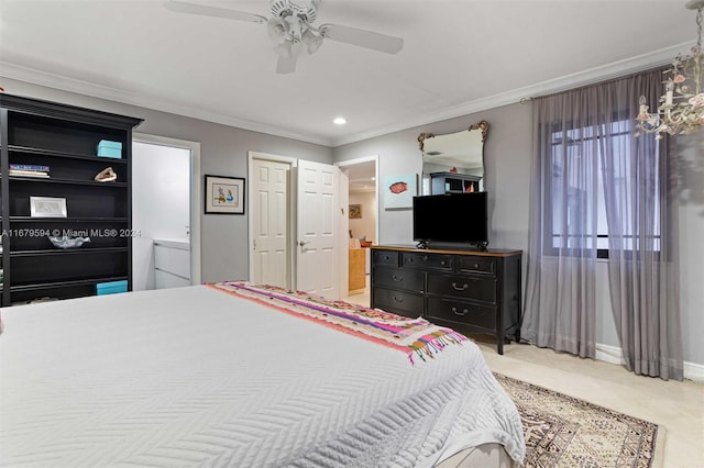 bedroom featuring crown molding, ensuite bathroom, light colored carpet, and ceiling fan