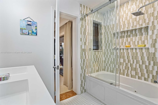 bathroom with tile patterned floors and tiled shower / bath