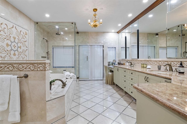 bathroom featuring shower with separate bathtub, a chandelier, tile walls, vanity, and tile patterned floors