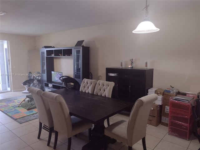 dining space with light tile patterned floors